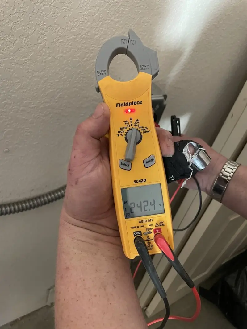 Voltage testing with clamp meter during Ceiling Fan Installation in Cornelius